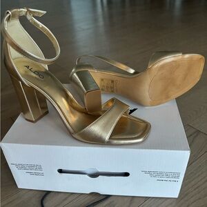 Brand new Aldo gold heels.